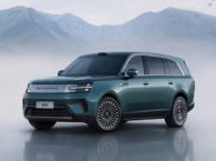 Xiaomi Sky Nomad N90 SUV in dark green parked on wet surface with misty mountain backdrop