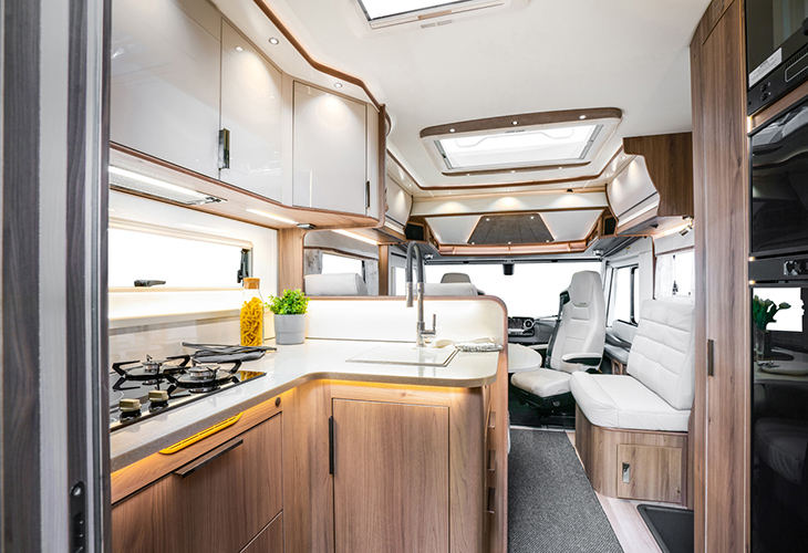 Kabe Imperial Ri810 LGB motorhome kitchen with wood cabinetry, hob and swivel cab seats
