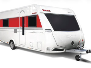 Kabe Royal 600 TDL caravan exterior with red and white stripe, single axle and front hitch, side entrance door visible