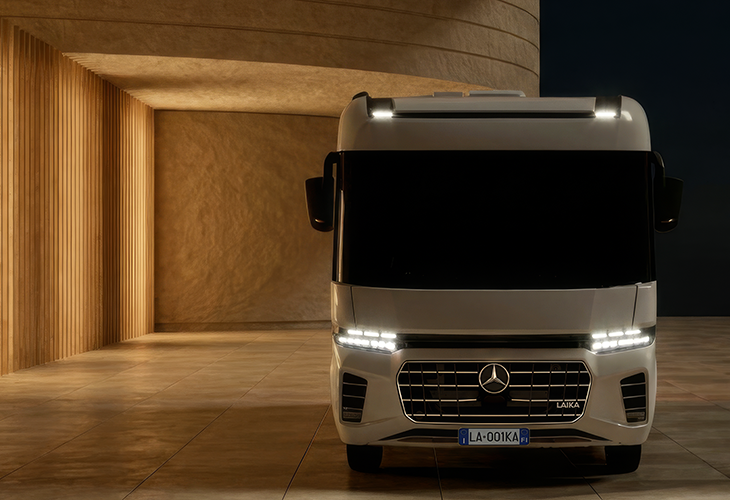 Front view of Laika Kreos H 5109 MB motorhome with Mercedes badge, LED lights, in a warm-lit interior setting.