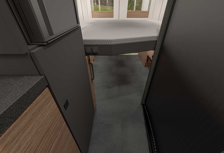 Malibu Relax 640 LE XR interior showing folded drop-down bed above narrow hallway to rear door.