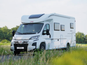 LMC Tracer motorhome with white chassis parked on rural road, part of LMC campers 2027 range