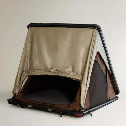Zara Home rooftop tent with hard-shell base, triangular frame and open beige and brown canvas doorway.