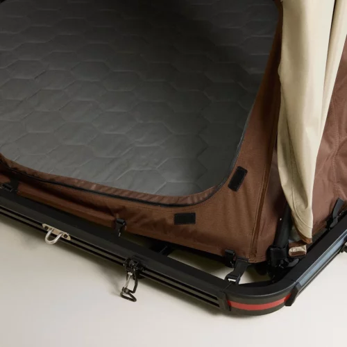 Zara Home rooftop tent showing quilted mattress interior and mounting frame on vehicle roof rack