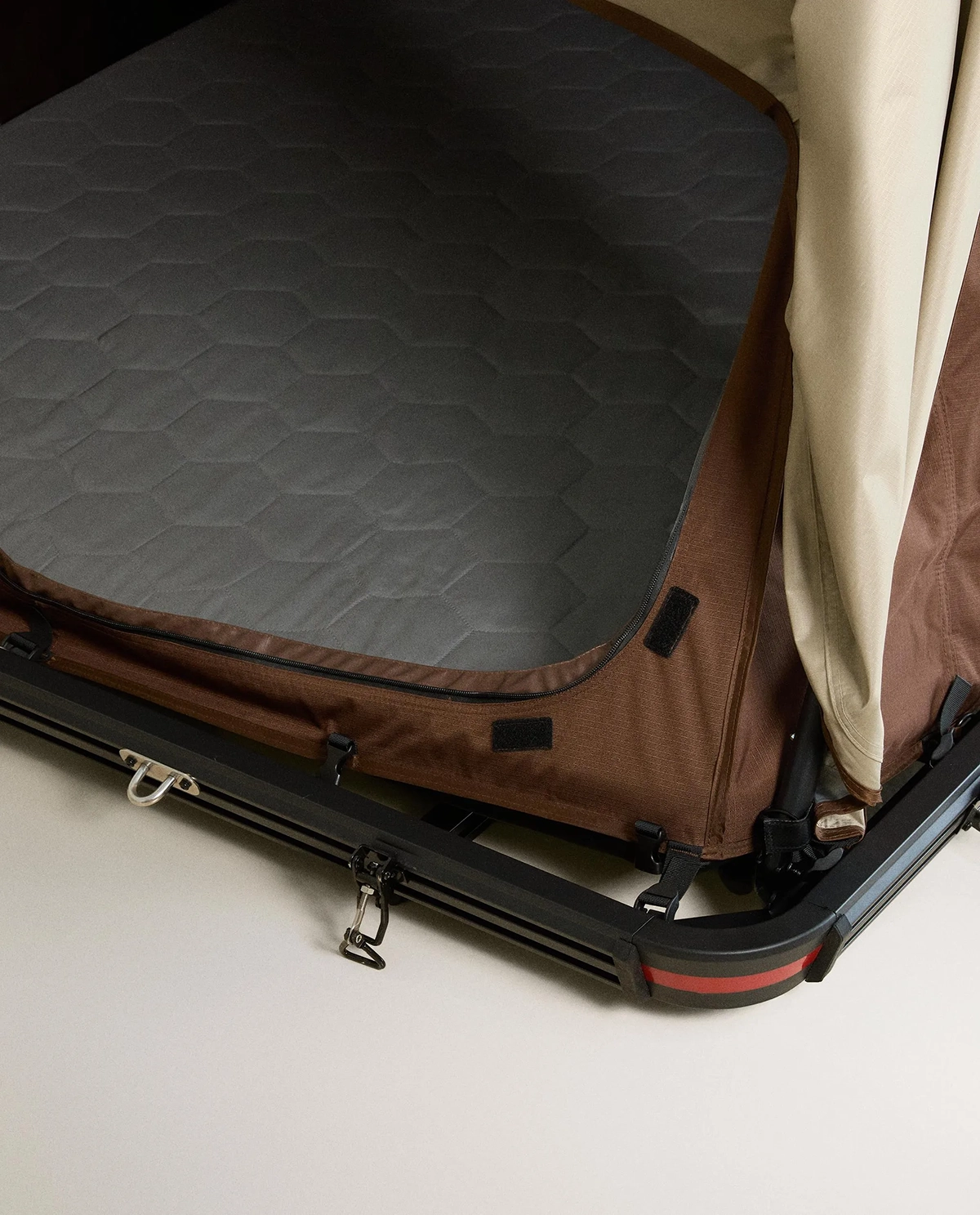 Zara Home rooftop tent showing quilted mattress interior and mounting frame on vehicle roof rack