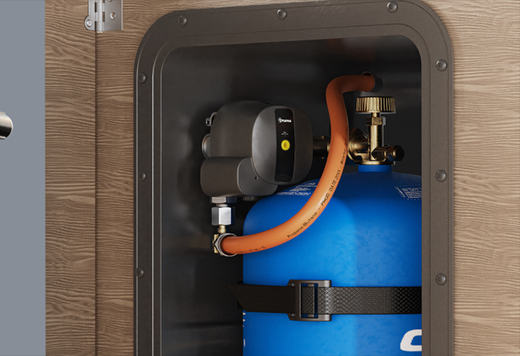 Truma MonoControl CS R crash sensor fitted to blue Campingaz cylinder in caravan storage locker