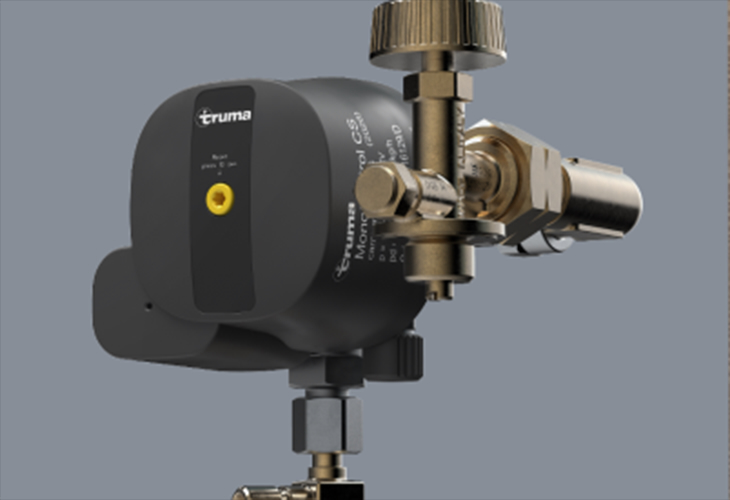 Truma MonoControl CS R gas pressure regulator with brass valve fittings and yellow reset button