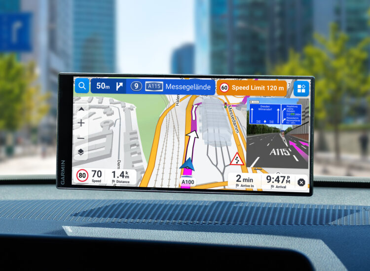 Garmin Drive navigation device mounted on car dashboard showing turn-by-turn directions towards A115 Messegelände