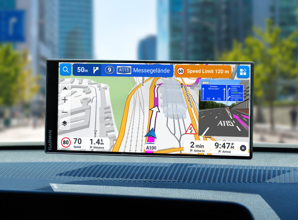 Garmin Drive navigation device mounted on car dashboard showing turn-by-turn directions towards A115 Messegelände