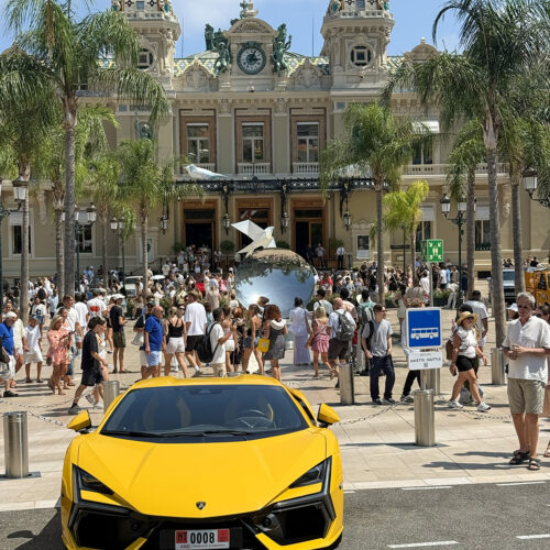 Yellow Lamborghini outside Monte Carlo Casino, a day trip highlight from camping Parc Bellevue Cannes