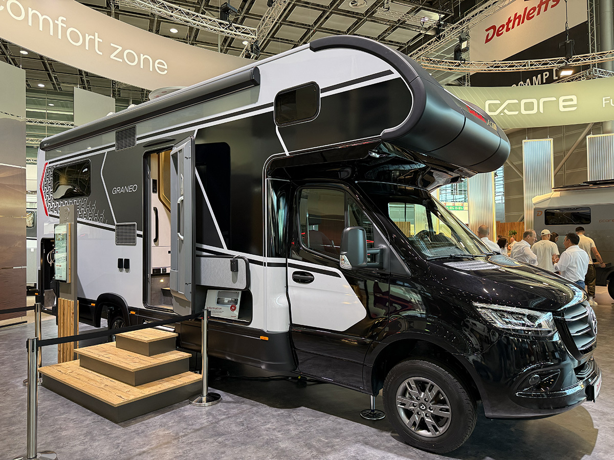 Dethleffs Graneo motorhome exterior with alcove bed, Mercedes cab, shown at trade show display