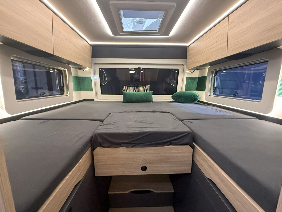 Frankia Noctra Liner motorhome rear bed area with twin beds, wooden cabinetry and skylight