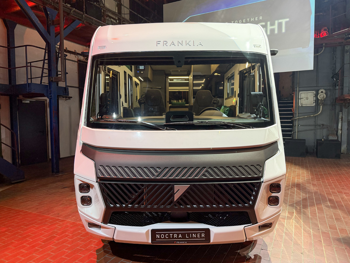 Front view of the Frankia Noctra Liner A-class motorhome, showcasing its sleek white design and angular headlights.