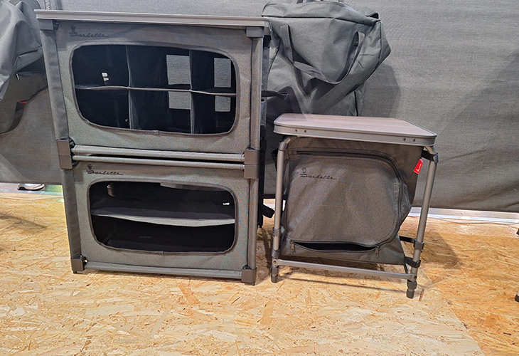 Isabella collapsible camping cabinets and side table with mesh storage compartments, shown on wooden flooring