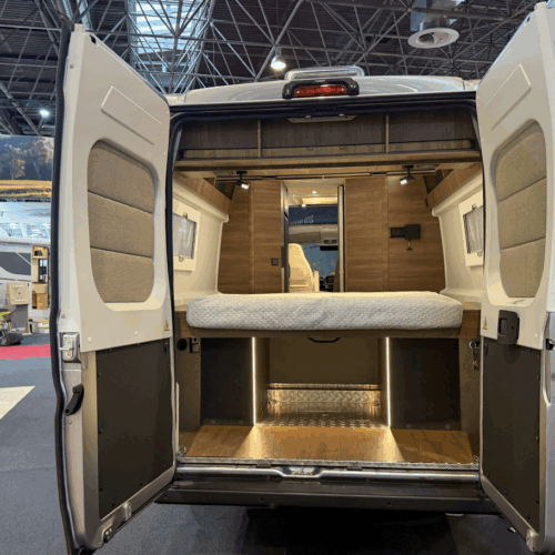 Rapido V64 rear view showing island bed and large under-bed storage garage through open back doors
