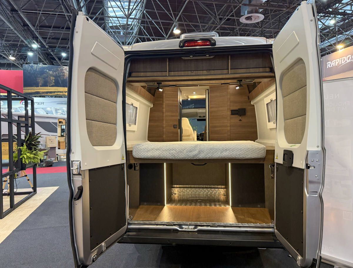 Rapido V64 rear view showing island bed and large under-bed storage garage through open back doors