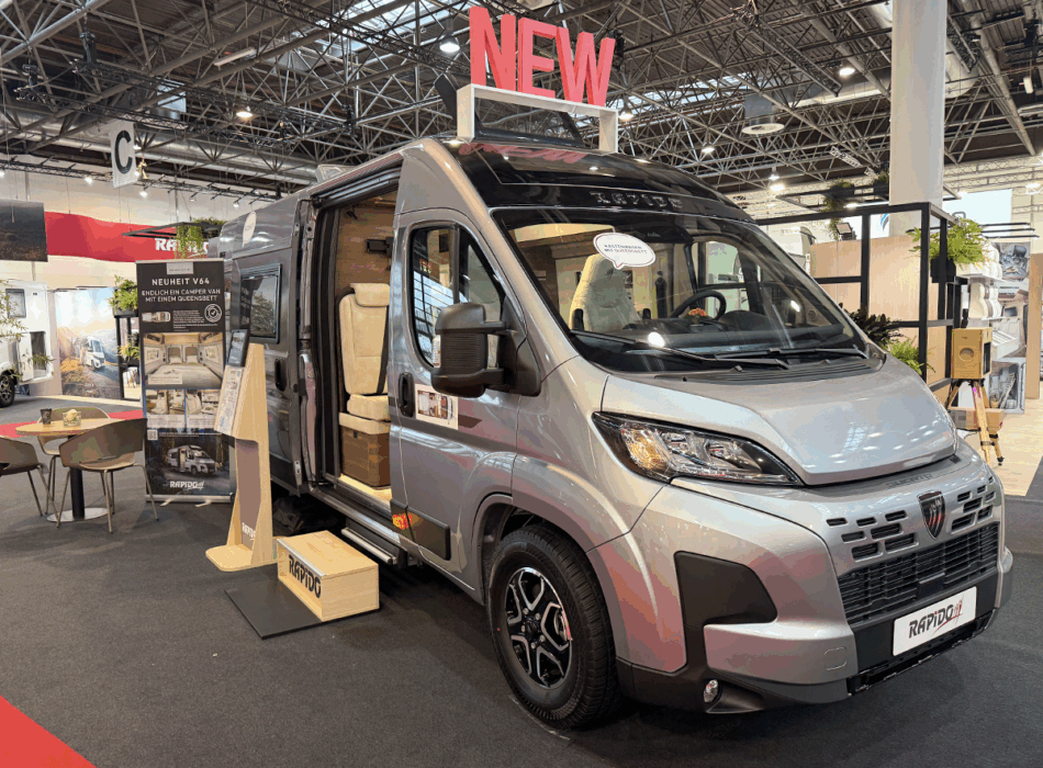 Rapido V64 camper van exterior on show floor, silver Fiat Ducato base with sliding door open, showing interior