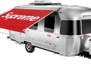 Erling Haaland Airstream travel trailer with extended red Supreme-branded awning and polished aluminium body