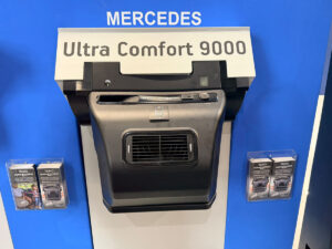 Teleco Ultra Comfort 9000M air conditioner unit on display at Mercedes exhibition stand with product leaflets