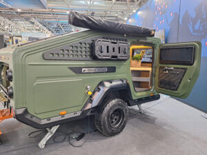 Urban Badger off-road compact caravan in olive green with open door, showcasing this eye-catching compact caravan's interior fittings.