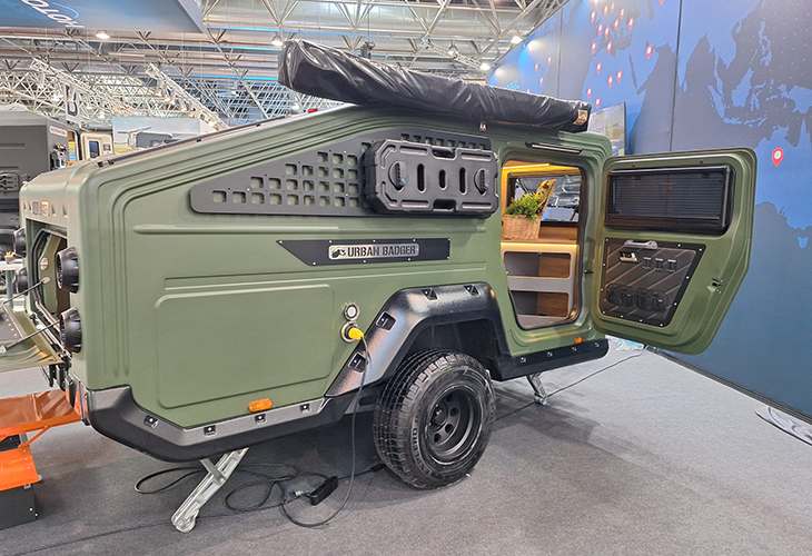 Urban Badger off-road compact caravan in olive green with open door, showcasing this eye-catching compact caravan's interior fittings.