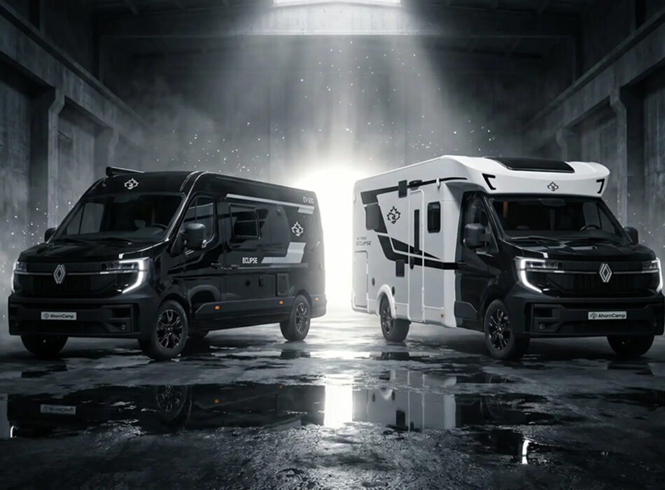 Ahorn Camp Eclipse Edition motorhomes in matte black and white, parked in dramatic lit warehouse setting