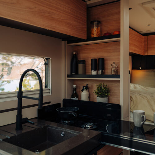 Bürstner Signature Mercedes motorhome kitchen with sink, hob and view through to bedroom area