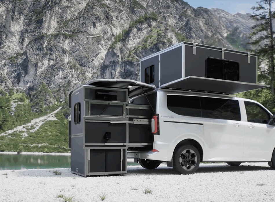 Cubivan camper van with pop-up rooftop tent and rear pull-out kitchen module, parked by mountain lake