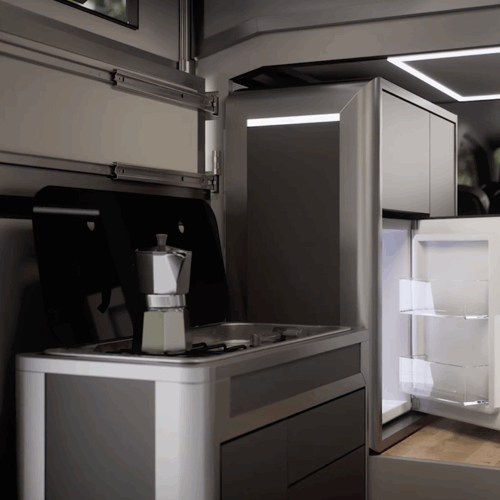 Cubivan camper van interior showing compact kitchen with gas hob, moka pot, open fridge and overhead storage units.