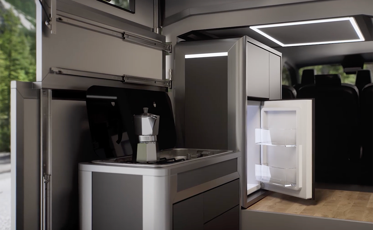 Cubivan camper van interior showing compact kitchen with gas hob, moka pot, open fridge and overhead storage units.