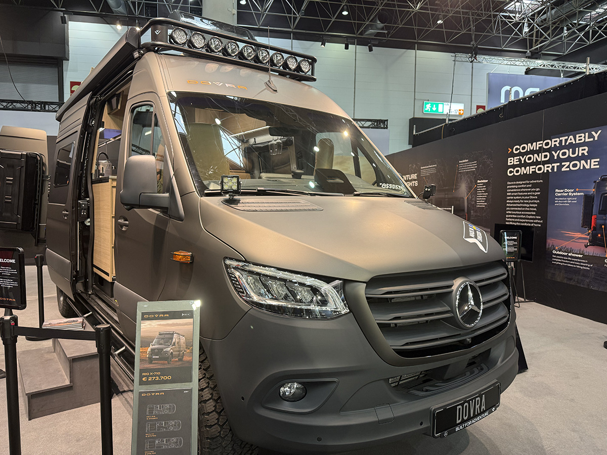 Dovra RIG X-710 camper van on Mercedes Sprinter chassis, matte finish with roof-mounted light bar, displayed at Caravan Salon