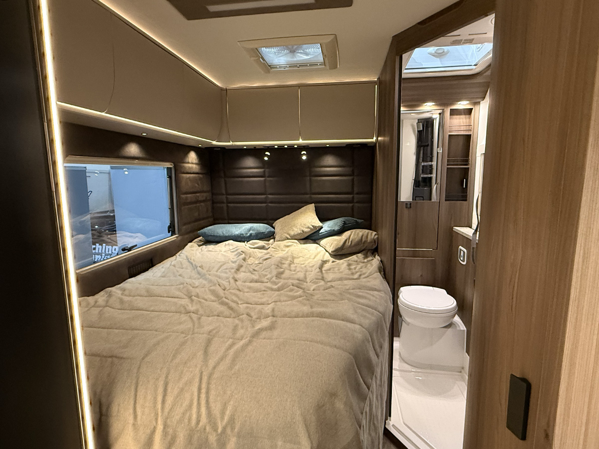 Kabe Novum Compact 720 LXL French bed with padded headboard and ensuite bathroom with toilet
