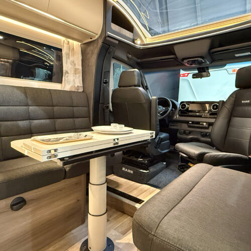 Kabe Novum Compact 720 LXL interior with swivel cab seats, dinette table and leather upholstery