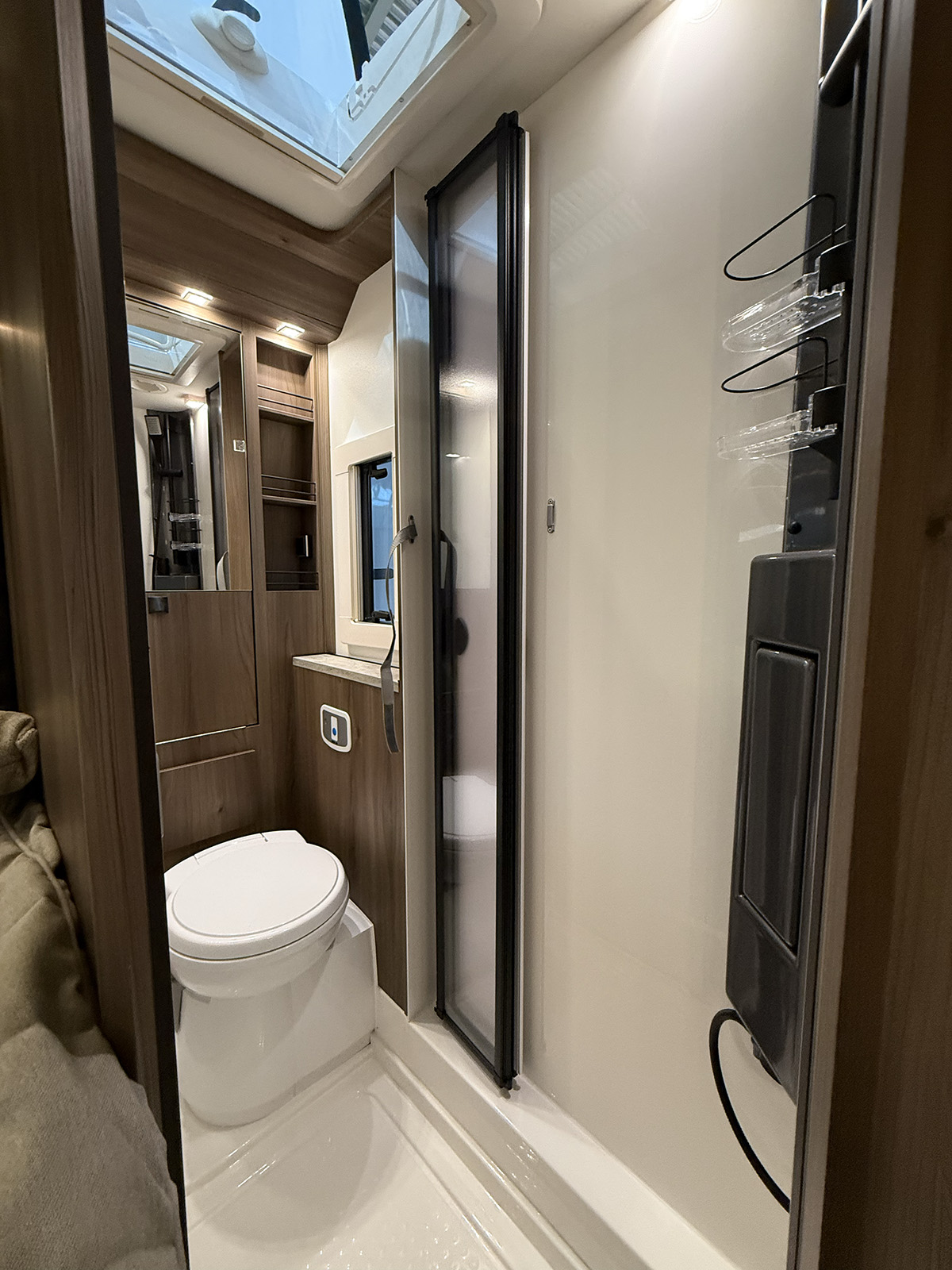 Compact bathroom with shower cubicle and toilet in the Kabe Novum Compact 720 LXL motorhome.