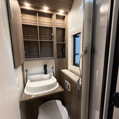 Compact bathroom with fold-out sink and toilet in the Kabe Novum Compact 720 LXL motorhome