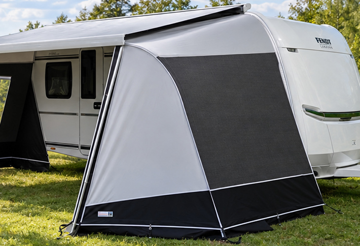 Unico Modena cassette awning side wall without window fitted to Fendt caravan awning on grass